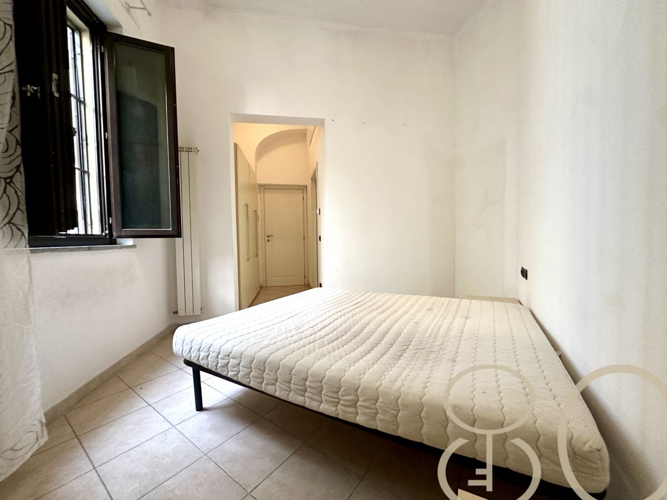 BILOCALE CON CORTILE PRIVATO E CANTINA COLLEGATA