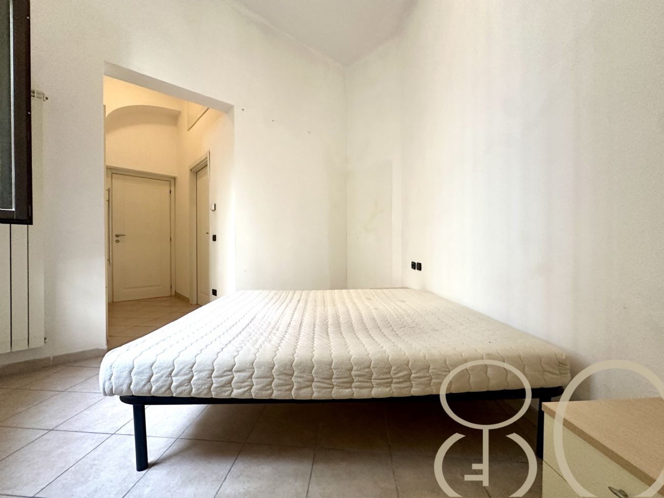 BILOCALE CON CORTILE PRIVATO E CANTINA COLLEGATA